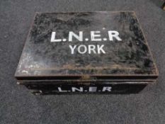 A metal deed box with hand painted writing L.N.E.R.