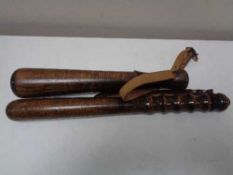 Two wooden truncheons