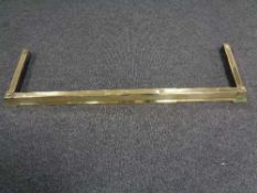 A brass extending fire curb