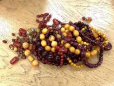 A very large quantity of cherry and amber coloured beads and necklaces CONDITION REPORT: