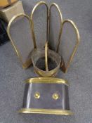 A brass four-way folding spark guard together with a brass fire front and coal bucket