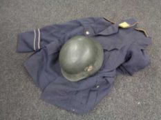 A WWII helmet with later decal and a German Air Force tunic