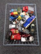 A wire basket containing mid century and later die cast vehicles, Corgi,