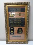 A gilt frame containing eight naval hat tallies together with four sew on badges