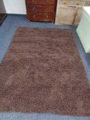 A brown shaggy rug