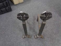A pair of cast iron fire dogs