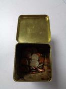 A tin of pre decimal coins,