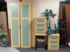 Two contemporary double door wardrobes, three drawer chest and kneehole desk.