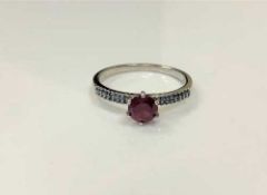 A silver synthetic ruby dress ring,