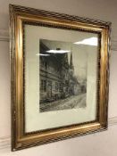 An early twentieth century etching depicting figures in a street