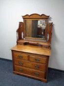 An Edwardian walnut dressing chest