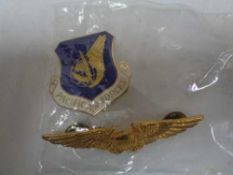Two American badges, enamelled air force badge,