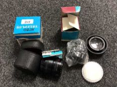 A boxed Auto Tele plus variable lens,