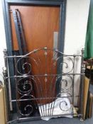 A contemporary metal 4'6 bed frame