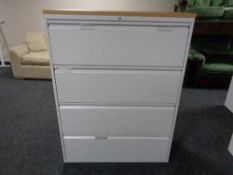 A four drawer metal document cabinet with oak effect top with no key
