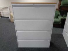 A four drawer metal document cabinet with oak effect top with key