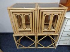 Two nests of three bamboo and wicker smoked glass topped tables and a further pair of side tables