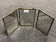 An early twentieth century brass three way table topped mirror, height 21 cm.