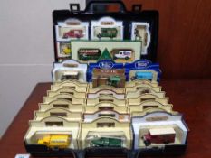 A plastic case of boxed die cast cars - Hamley's delivery vehicles,