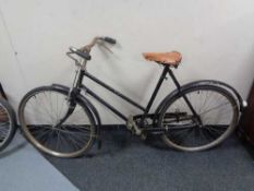 A vintage bicycle with leather saddle