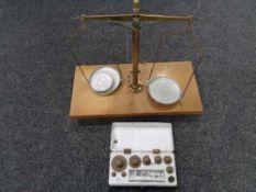A set of chemist's micro balance scales together with a boxed set of weights