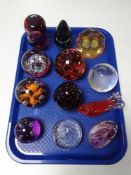 A tray of glass paperweights