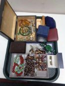A tray of costume jewellery, beaded necklaces, gent's cufflinks, brooches,
