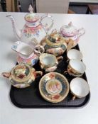 A tray of continental gilded eleven piece tea service, antique floral patterned teapot,