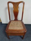 A mahogany bergere seated commode chair