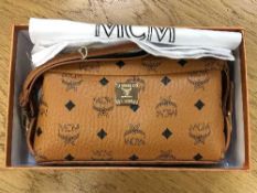 A lady's MCM hand bag in box with receipt and dust cover