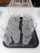 A tray of glass ware, water jug and cut glass beakers,