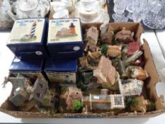 A box of eight Little Light of Mine lighthouse ornaments together with a quantity of cottage