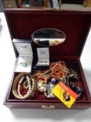 A leather jewellery box of necklaces, earrings,