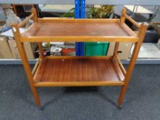 A twentieth century teak two tier trolley