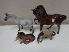 A Royal Doulton Brown gloss horse and foal together with two further horse figures (4)