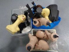 Two boxes and a bag of mannequin heads, vases,