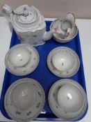 A Newhall porcelain teapot and cover, circa 1790, of commode form, puce mark to underside,