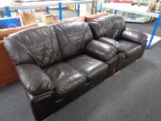 A brown leather two seater settee with matching armchair