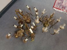 Four brass chandeliers