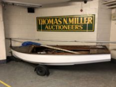 A 14' sailing boat with sail, with plaque 'Built by The Aln Boatyard, Alnmouth',