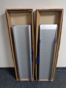 A pair of car wheel chair ramps