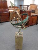 A garden armilary sphere on concrete plinth