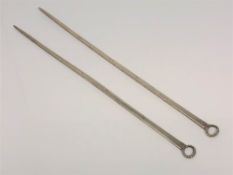 A pair of Georgian silver meat skewers