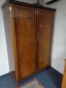 A walnut Queen Anne style double door wardrobe