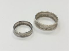 A Victorian 1888 shilling ring, size P, and large 1918 half crown ring,