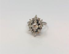 A fine 18ct white gold diamond cluster ring, the principal stone approximately 0.