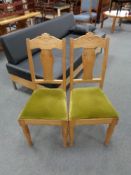 A set of five twentieth century blond oak dining chairs