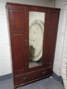 An Edwardian stained pine mirror door wardrobe (a/f)
