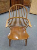 A twentieth century oak stick backed armchair