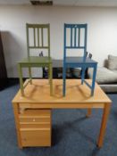 A contemporary pine effect office table fitted a drawer together with three drawer under desk